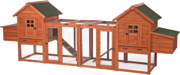 Two wooden chicken coops with green roofs.